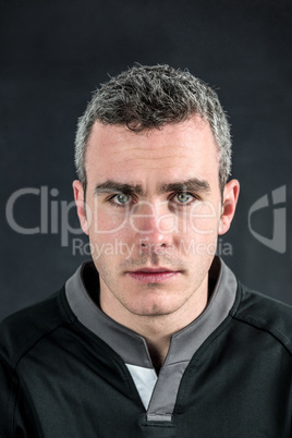 A rugby player looking at the camera