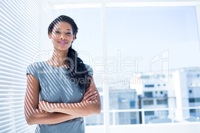 Smiling businesswoman standing in the office