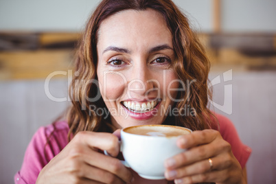 Young woman having a coffee