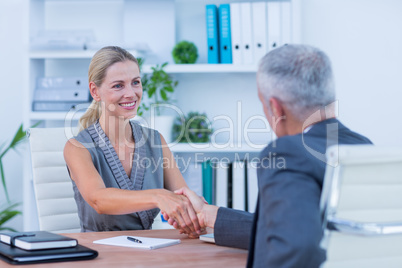 Businessman holding hand of businesswoman