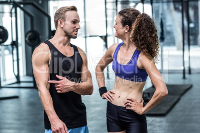 A muscular couple discussing together A muscular couple discussing together