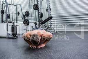 Muscular man doing push-ups