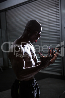 Young Bodybuilder posing in front of the camera