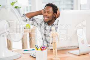 Young smiling businessman relaxing