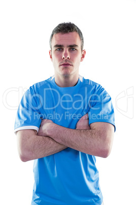 Serious rugby player with arms crossed