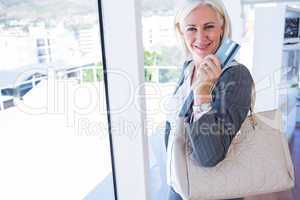 Happy businesswoman holding credit card