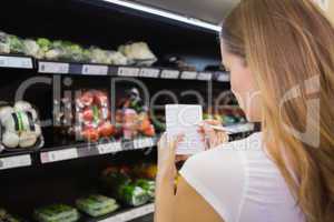 Woman writing in her notepad in aisle