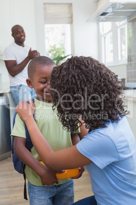 Mother and father prepare his son to going at school