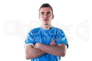 Serious rugby player with arms crossed