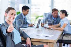 Business people speaking together during meeting