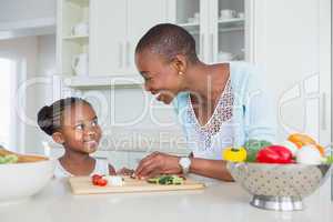 Mother and daughter making a salad together