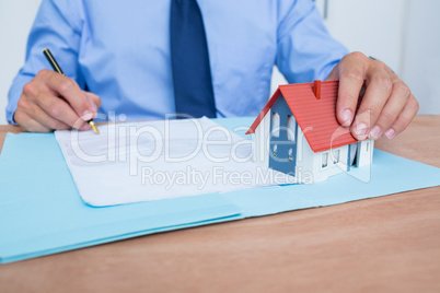 Businessman reading a contrat before signing it
