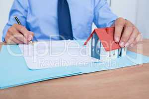 Businessman reading a contrat before signing it