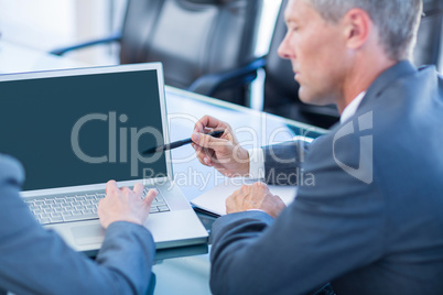 Business people working on laptop computer