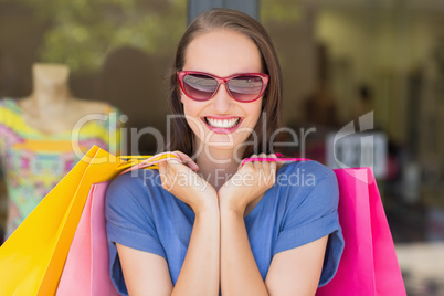 Happy woman carrying shopping bags