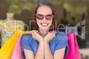 Happy woman carrying shopping bags