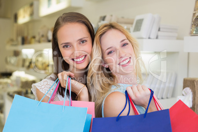 Happy women standing together and smiling at camera