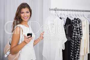 Portrait of smiling woman using smartphone