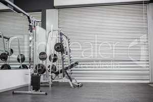 Exercise room with shutters and mirrors