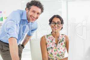 Portrait of a smiling casual young couple at work