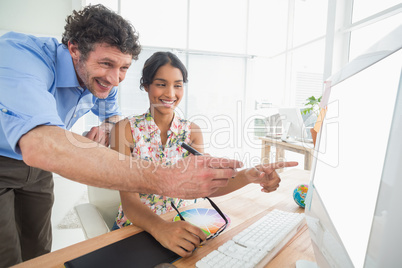 smiling casual young couple at work