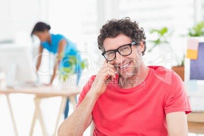 Man posing in front of his colleague