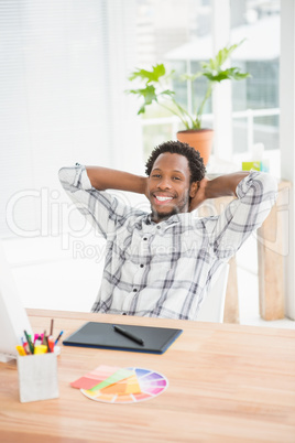 Young businessman sitting at his desk