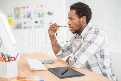 Concentrated casual businessman working with computer