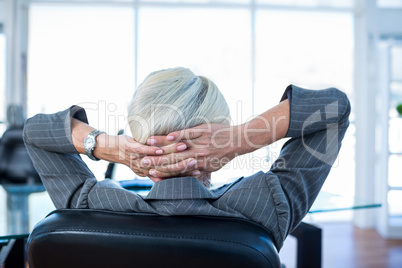 Wear view of businesswoman relaxing