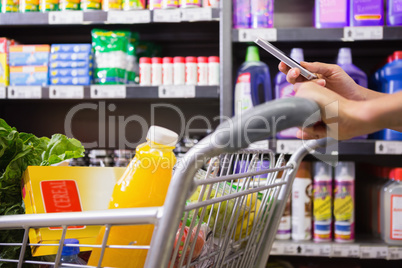 woman buy products and using his smartphone