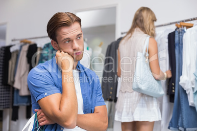 A bored man with his hand under his chin