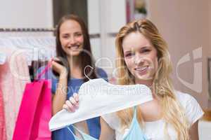 Happy friends doing shopping together