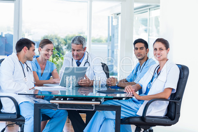 Team of smiling doctors having a meeting