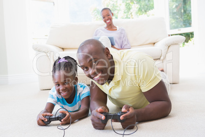 Portrait of a happy smiling father playing with her daughter at