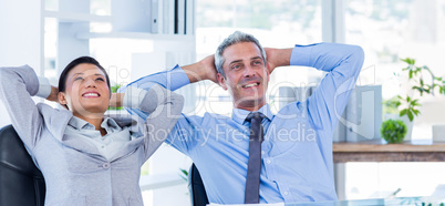 Business people relaxing in swivel chair