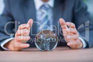 Businessman forecasting a crystal ball