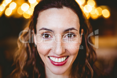 Close up of pretty brunette smiling at camera