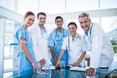 Doctors and nurses smiling at camera