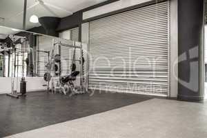 Exercise room with shutters and mirrors