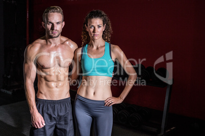 Muscular couple looking at the camera