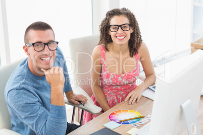 Portrait of smiling coworkers with glasses