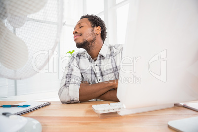 Young businessman sitting at his desk