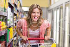 Smiling pretty blonde woman buying a products