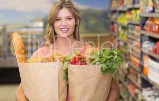 Portrait of pretty blonde woman buying food products