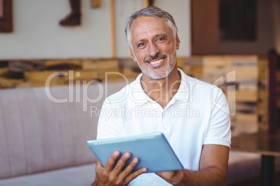 Casual man using his tablet