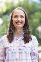 Portrait of smiling pretty brunette looking away