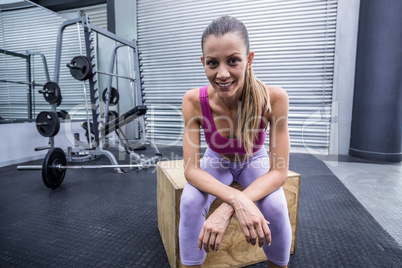 Smiling muscular woman looking at the camera