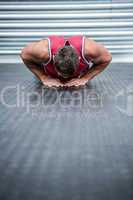 Muscular man doing push-ups