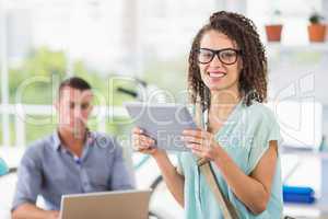 Creative businesswoman holding digital tablet