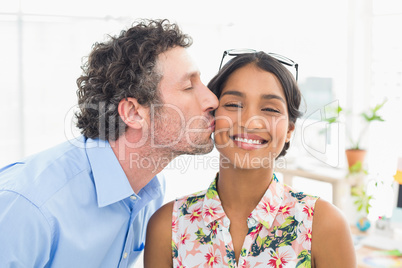 Portrait of a smiling casual young couple at work